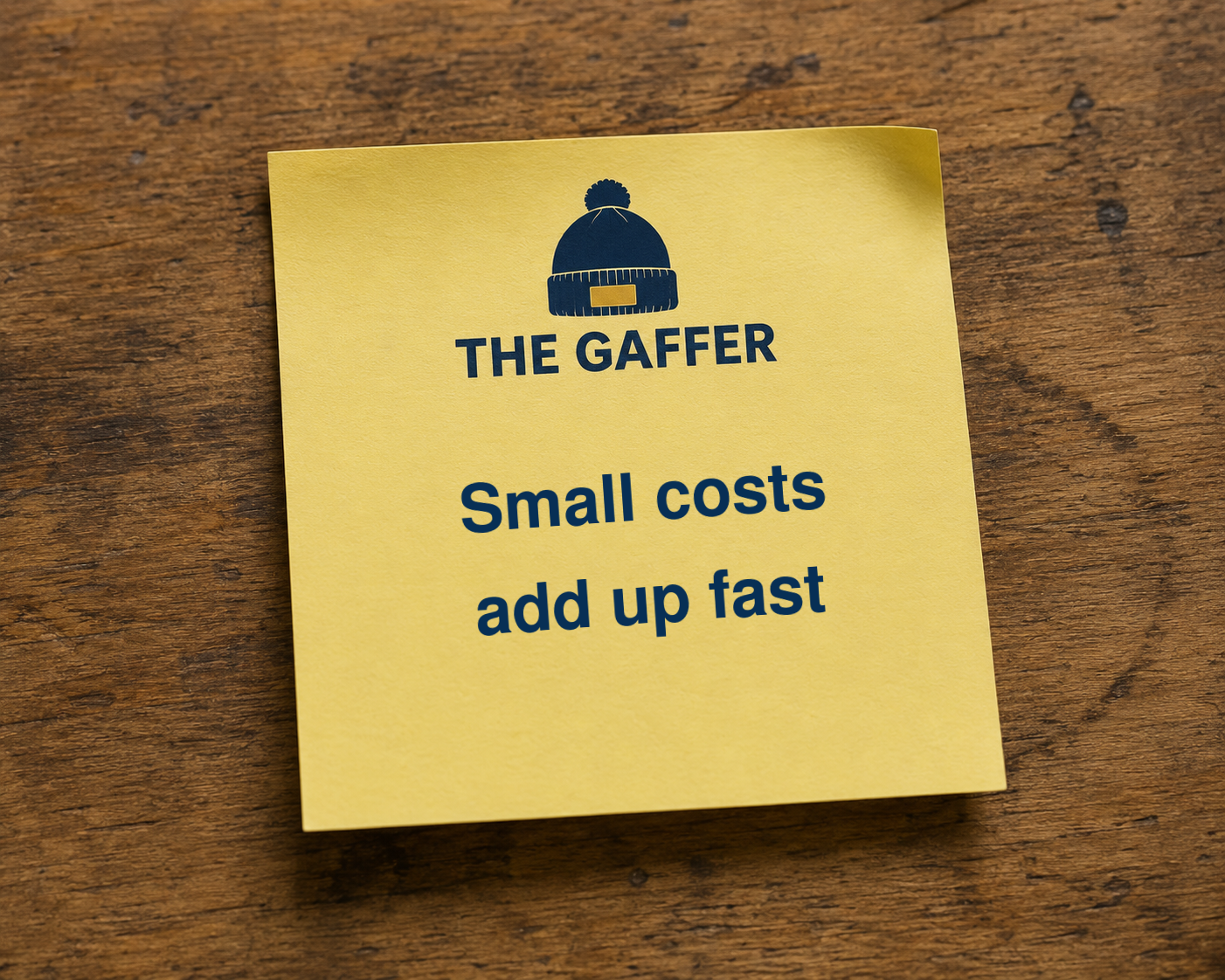 Yellow Post-it note on a wooden desk, headed with The Gaffer bobble-hat logo, reading: Small costs add up fast.