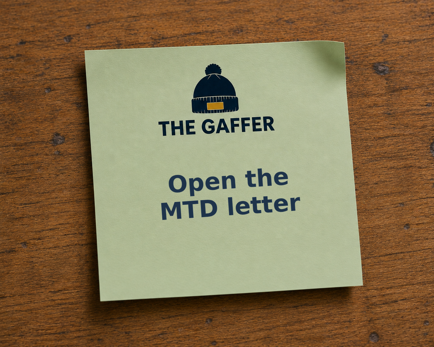 Sage green Post-it note on a wooden desk, headed with The Gaffer bobble-hat logo, reading: Open the MTD letter.